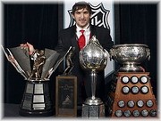 Washington Capitals hockey player Alex Ovechkin, of Russia , poses with, from left, the Rocket Richard, Lester B. Pearson, Hart and Art Ross trophies after winning them at the NHL awards ceremony in Toronto on Thursday June 12, 2008. &copy; www.examiner.com